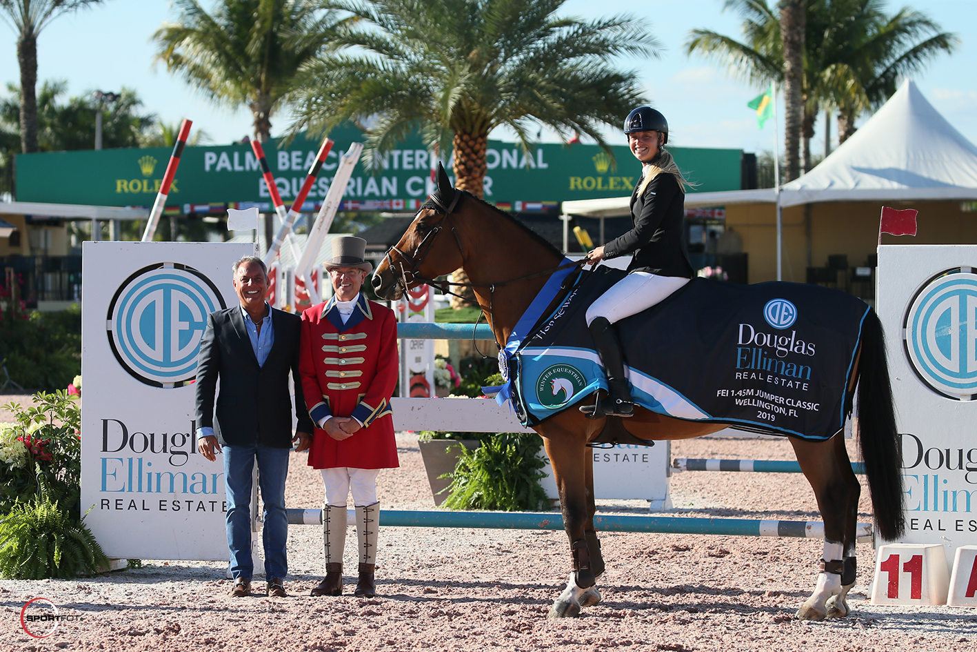 Todd Jenard of Douglas Elliman Real Estate, Ringmaster Steve Rector, and Kristen Vanderveen. Photo © Sportfot.