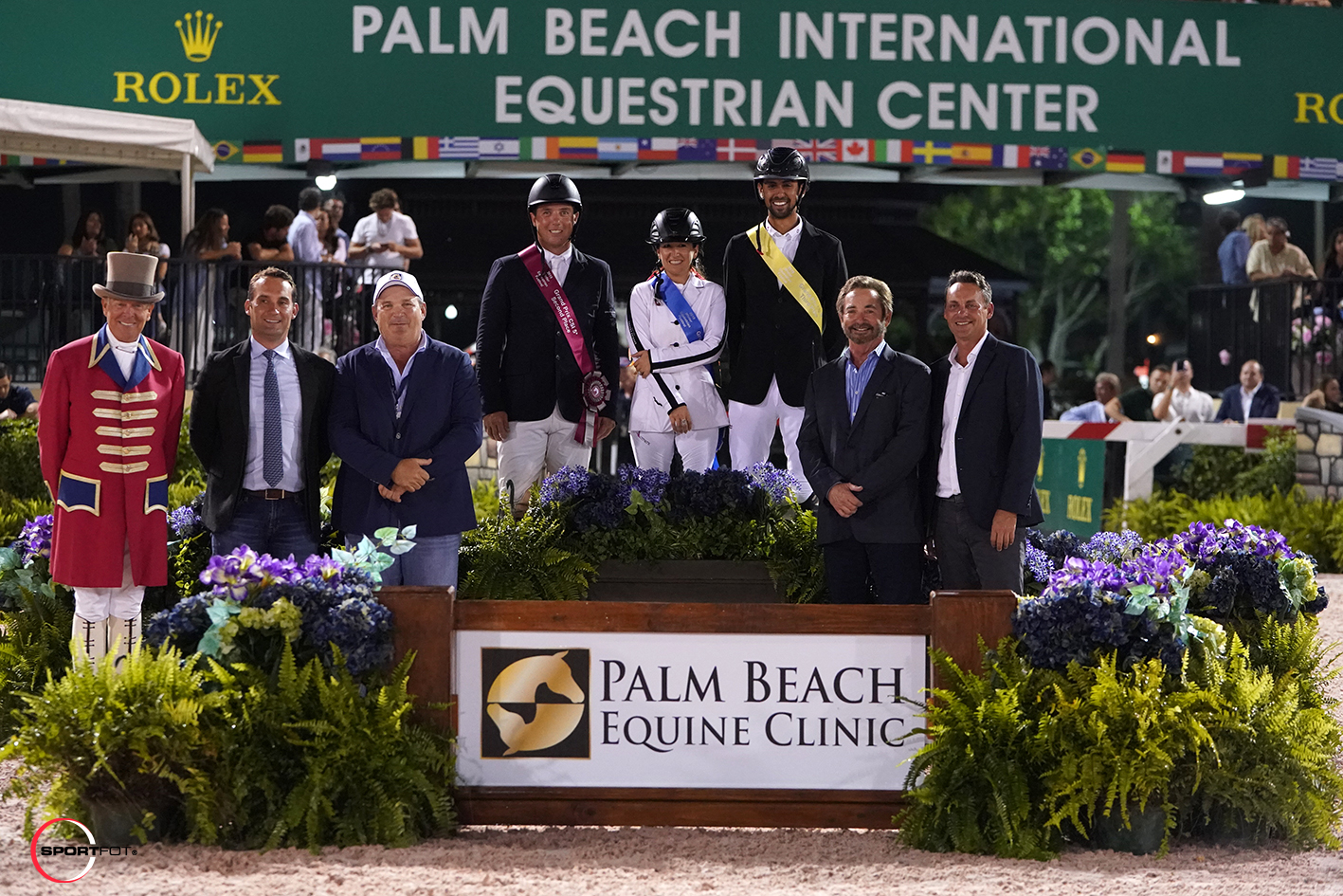 Alex Granato, Danielle Goldstein, and Nayel Nassar on the podium joined ringmaster Steve Rector along with Dr. Richard Wheeler, Dr. Robert Brusie, Dr. Scott Swerdlin, and Dr. Bryan Dubynsky of Palm Beach Equine Clinic. Photo © Sportfot.