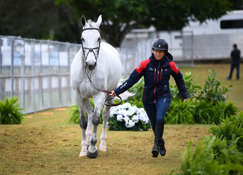 Beezie Madden jogs at the CSIO5* Longines FEI Jumping Nations Cup™ USA at Deeridge Farms. Photo by US Equestrian