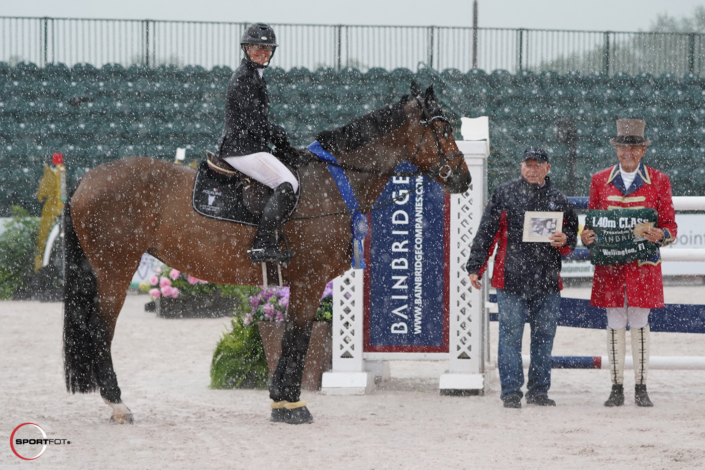 Erynn Ballard with Bainbridge CEO and Chairman Richard Schechter, and ringmaster Steve Rector. Photo © Sportfot