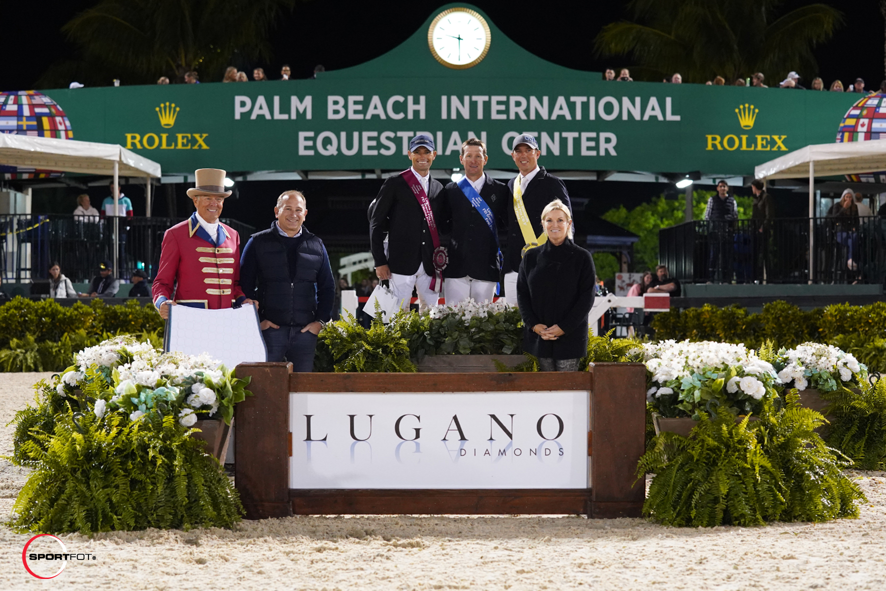 Second-place finisher Capt. Brian Cournane, winner McLain Ward, and third-place Alex Granato are joined by ringmaster Steve Rector, Moti Ferder, Owner and CEO of Lugano Diamonds, and Denise Wynne, Sales Manager for Lugano Diamonds.