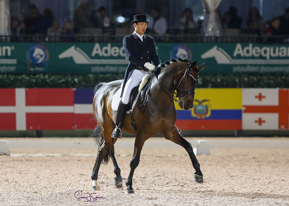 Dongseon Kim (KOR) bows out of international dressage riding Belstaff to 72.43% and second place.