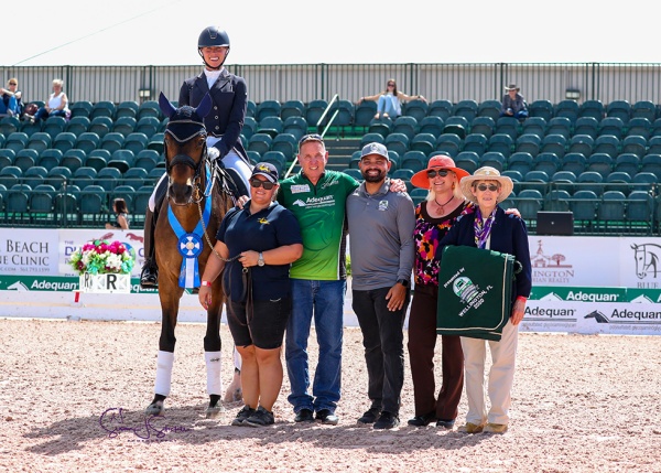 Megan Lane and Zodiac MW with her groom, Adequan®’s Allyn Mann, Wellington Agricultural Services president José Gomez, judge at C Kari McClain and chief steward Lisa Gorretta.