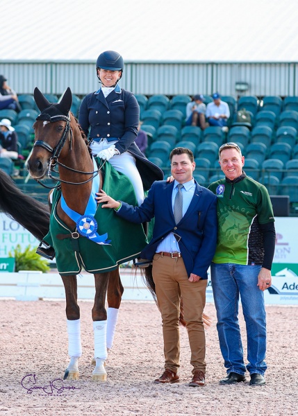 Katie Johnson and new ride Quartett post their first international win, topping the FEI Intermediate CDI1*. Seen here with judge Raphael Saleh and Adequan®’s Allyn Mann.