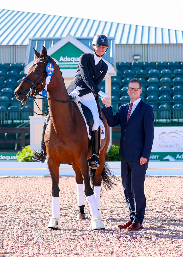 FEI Intermediate II CDI3* winner Yvonne Losos de Muñiz (DOM) in the prize-giving with judge Nick Burton.