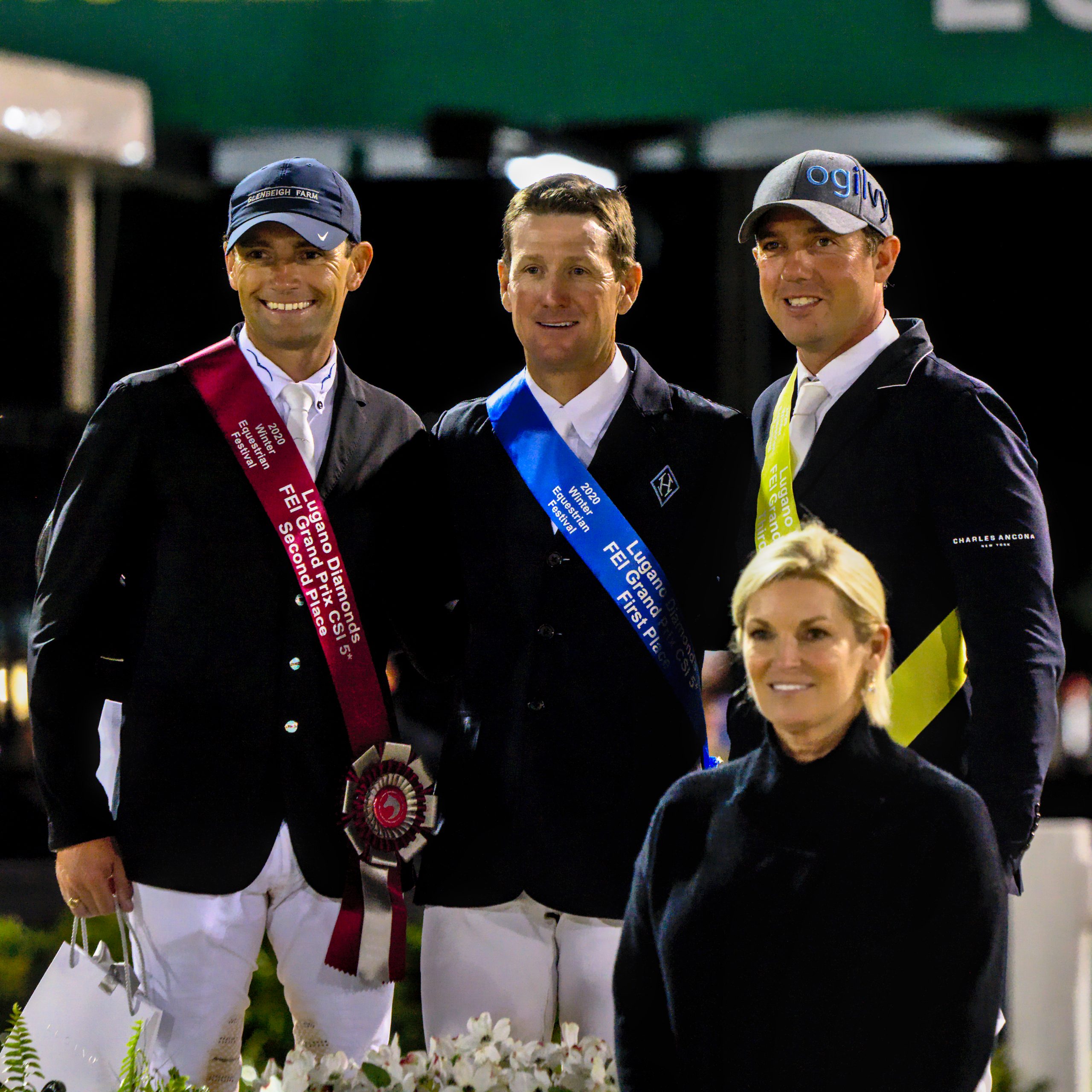 The three top riders on podium for awards in  $401,000 Lugano Diamonds Grand  Prix CSI5*