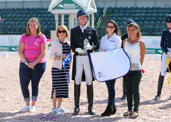 Under-25 champion Ben Ebeling with Whitney Fernandes of Adequan®, Terri Kane, and Jessica Newman and Molly McDougall of Just World International. ©SusanStickle.com