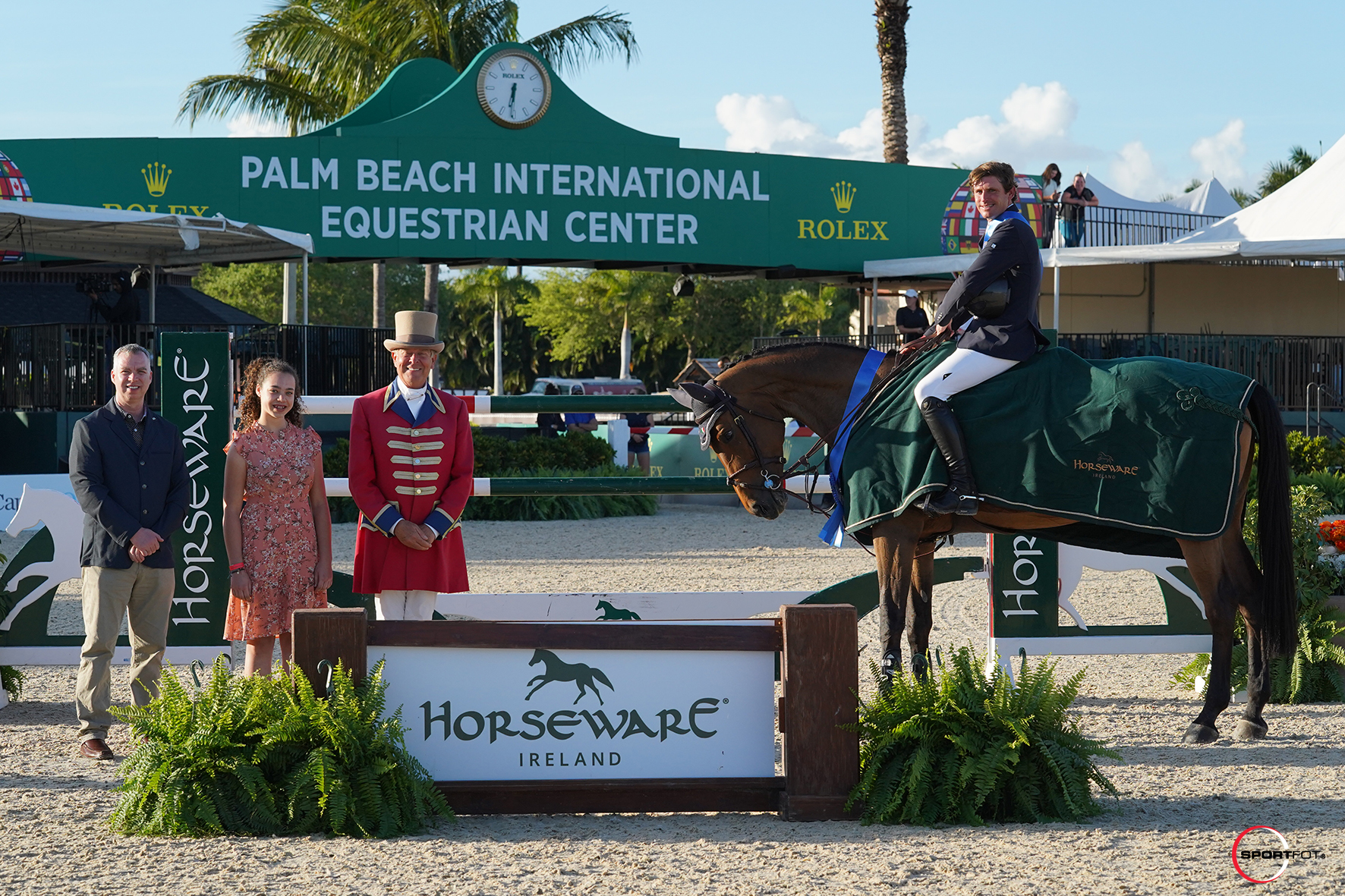 Darragh Kenny and Scarlett du Sart Z in their winning presentation with Kelly Nicholls, VP North America of Horseware Ireland, Jillian Nicholls, and ringmaster Steve Rector. 