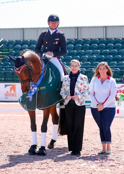 Endel Ots (USA) with judge Irina Maknami and Whitney Fernandes of Adequan®.