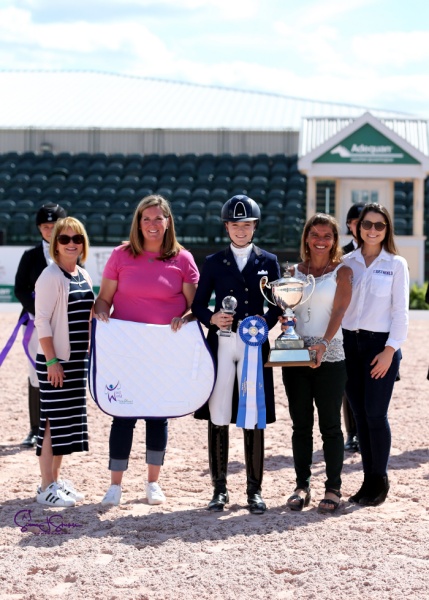 Overall and young rider champion Natalia Bacariza Danguillecourt with Terri Kane, Whitney Fernandes of Adequan® and Jessica Newman and Molly McDougall of Just World International.