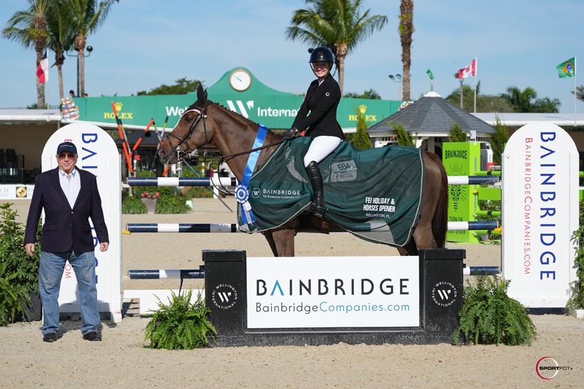 Ashley Vogel & Bellissimo Z presented as winners by Richard Schechter in the $6,000 Bainbridge Companies Holiday & Horses Opener 1.40m © Sportfot