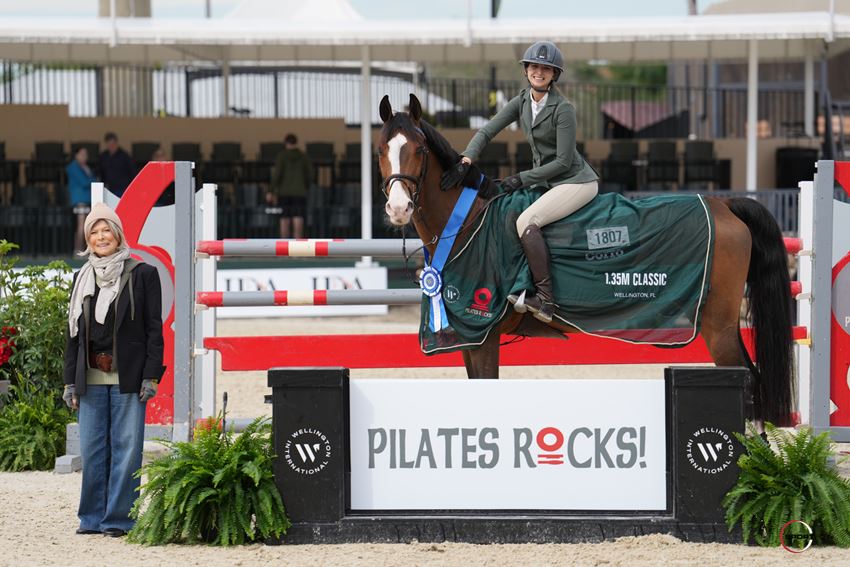 Abigail McArdle & I&H Boogy Woogy presented as winners by Pilates Rocks Owner, Elissa Salzman, of the $5,000 1.35m Pilates Rocks Open Stake © Sportfot
        