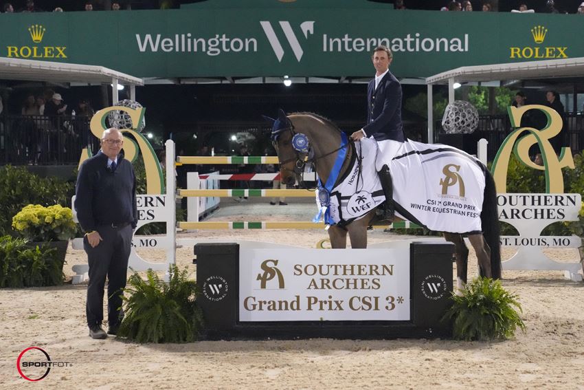 Ben Maher & Enjeu de Grisien, presented as winners of the $140,000 Southern Arches CSI3* Grand Prix by Michael Stone, President of Wellington International. Photo © Sportfot