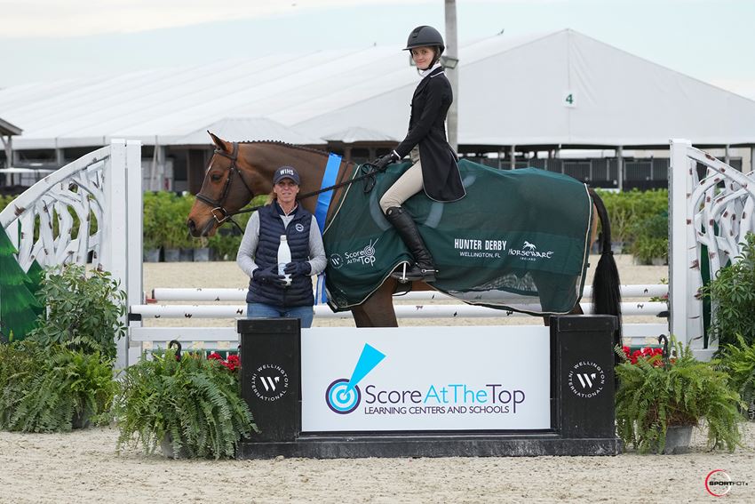 Serena Theodoracopulos & Permission presented as winners in the $1,000 Score At The Top 2'6" - 2'9" Hunter Derby © Sportfot
        