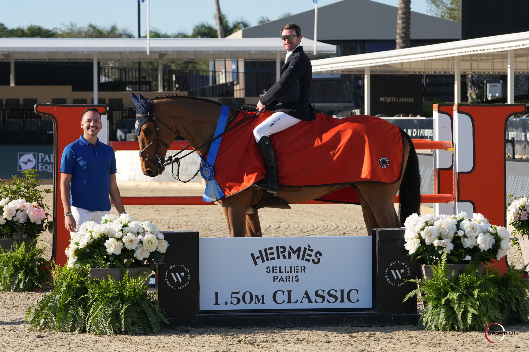 Darragh Kenny & Caccossini are presented as winners of the $32,000 Hermès CSI3* 1.50m Classic by Ray Vega, Equestrian Account Executive for Hermès. Photo © Sportfot