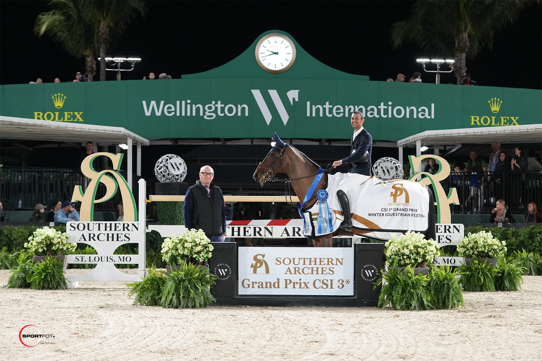 Nayel Nassar & ESI Ali are presented as winners of the $140,000 Southern Arches CSI3* Grand Prix by Michael Stone, President of Wellington International. Photo © Sortfot